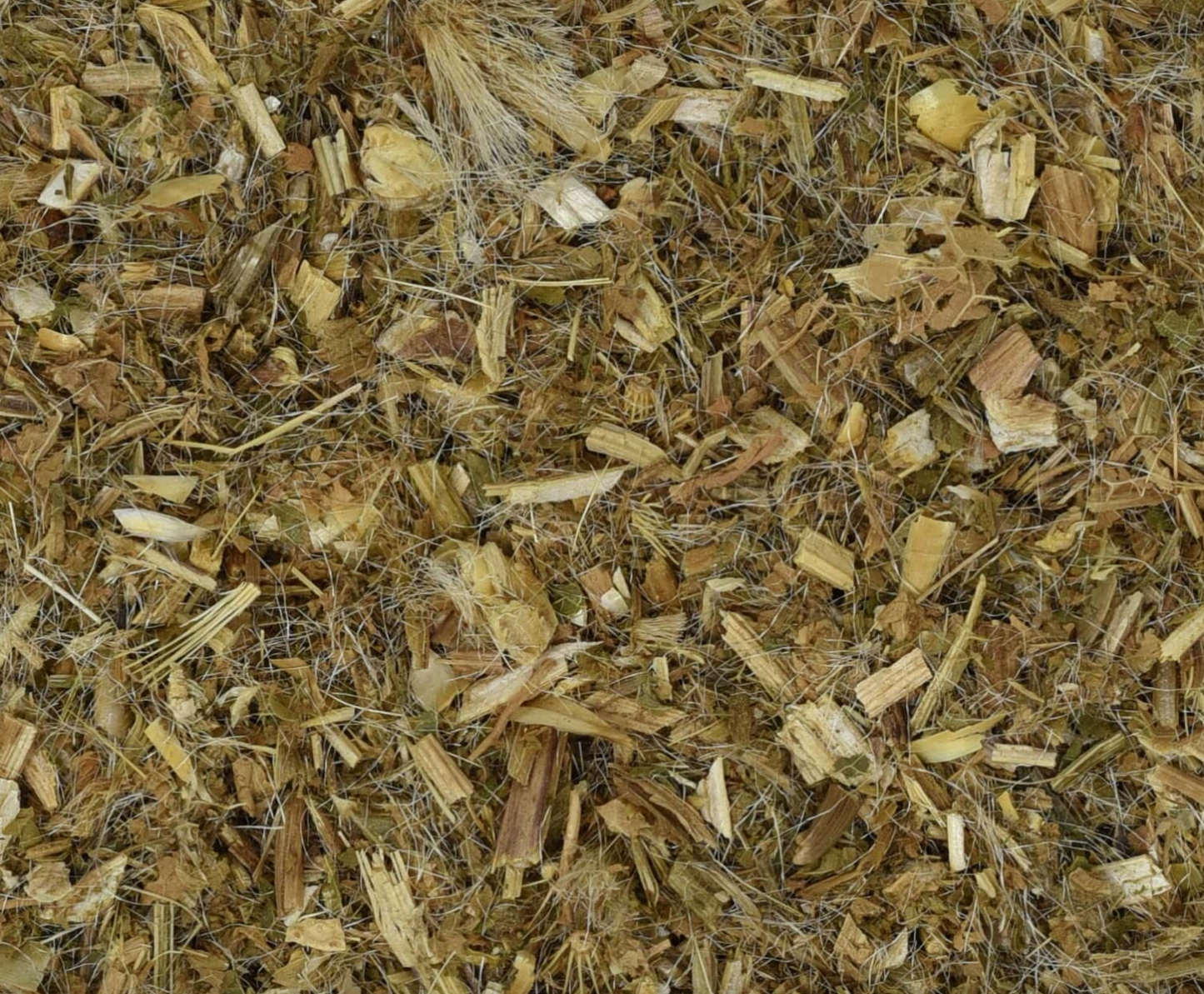 Close-up of dried blessed thistle herb, showing chopped stems, leaves, and pieces used for teas and herbal remedies.