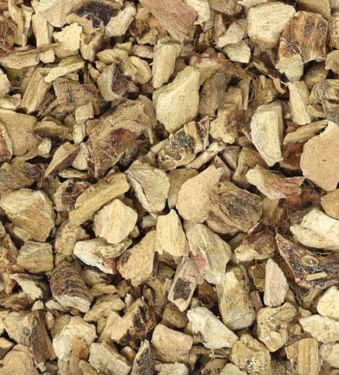 Close-up of dried calamus/sweet flag root, showing beige and brown root pieces, used for teas and herbal remedies.