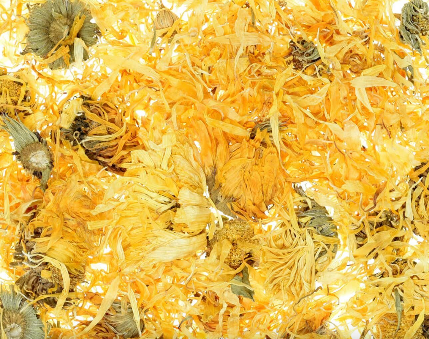 Close-up of dried whole calendula flowers, showing yellow blossoms with green stems, used for teas and herbal remedies.