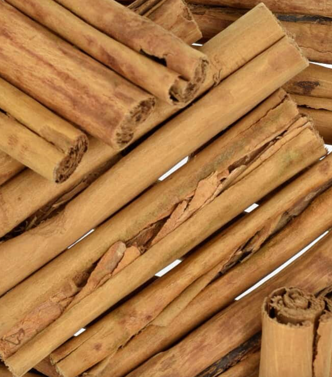 Close-up texture of whole cinnamon sticks, showing brown sticks used for teas and herbal remedies.