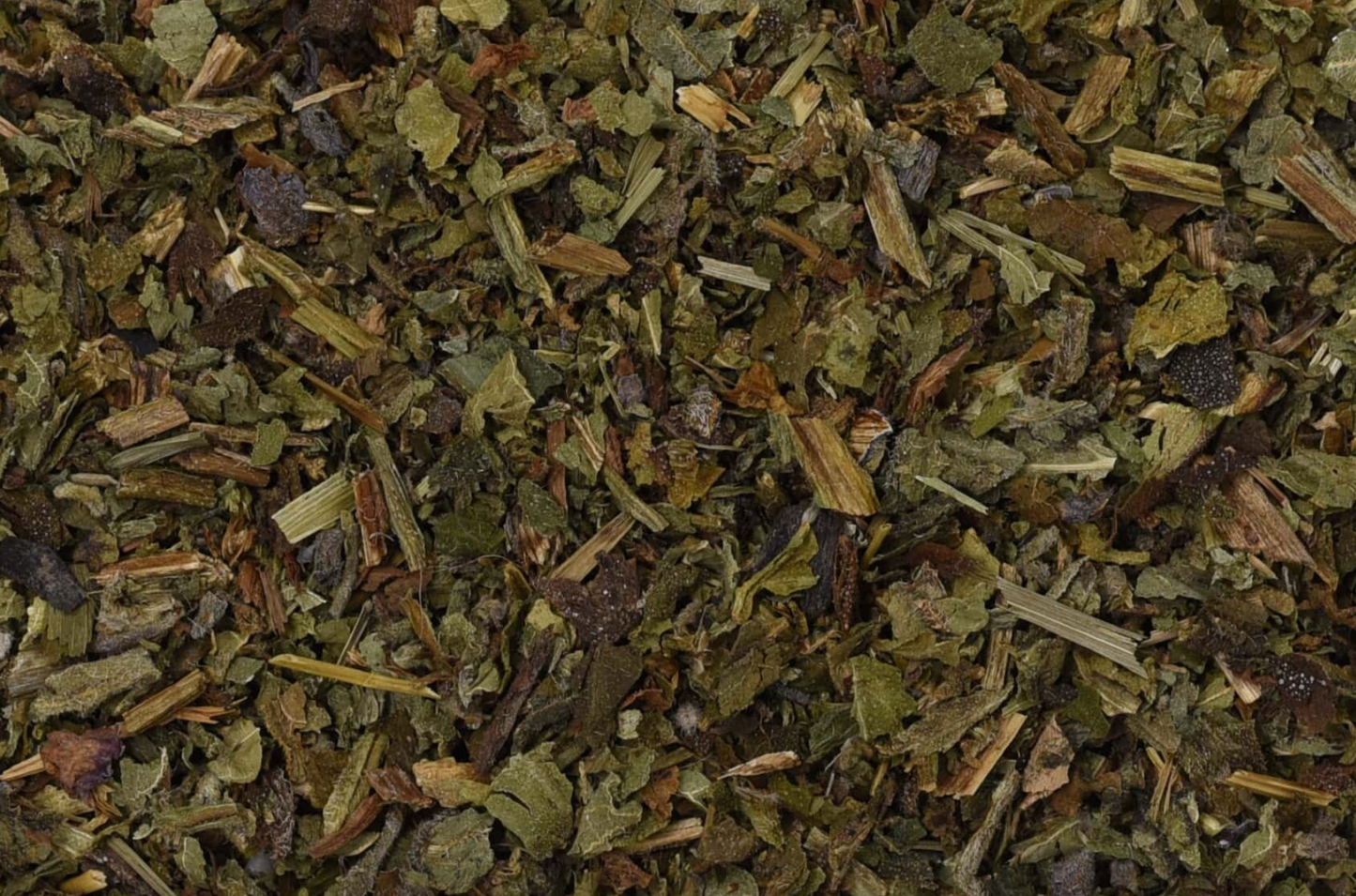 Close-up texture of dried comfrey leaf, showing green leaves used for teas and herbal remedies.