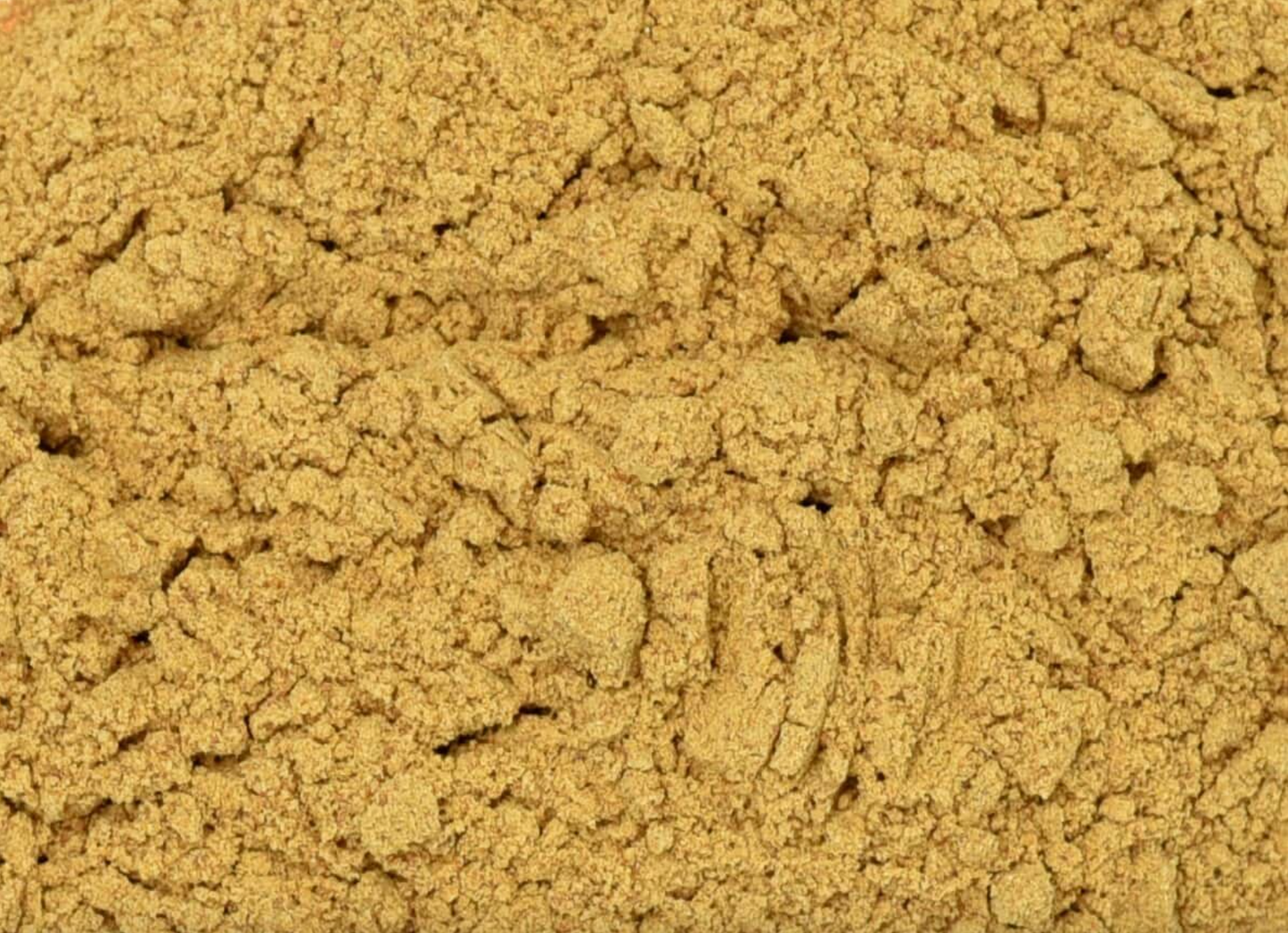 Close-up texture of dried cordyceps mushroom powder, showing brown powder used for teas and herbal remedies.