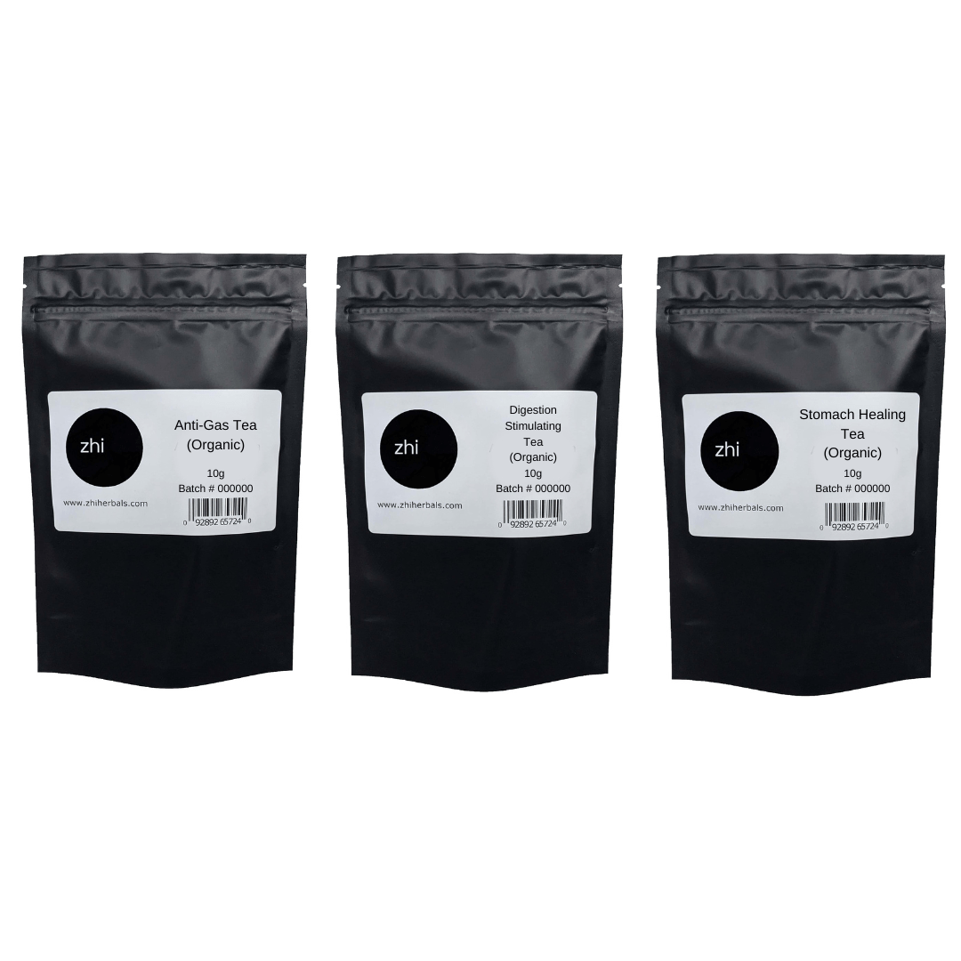 A row of three Zhi Herbals teas in 10g black resealable bags with product labels and barcodes.