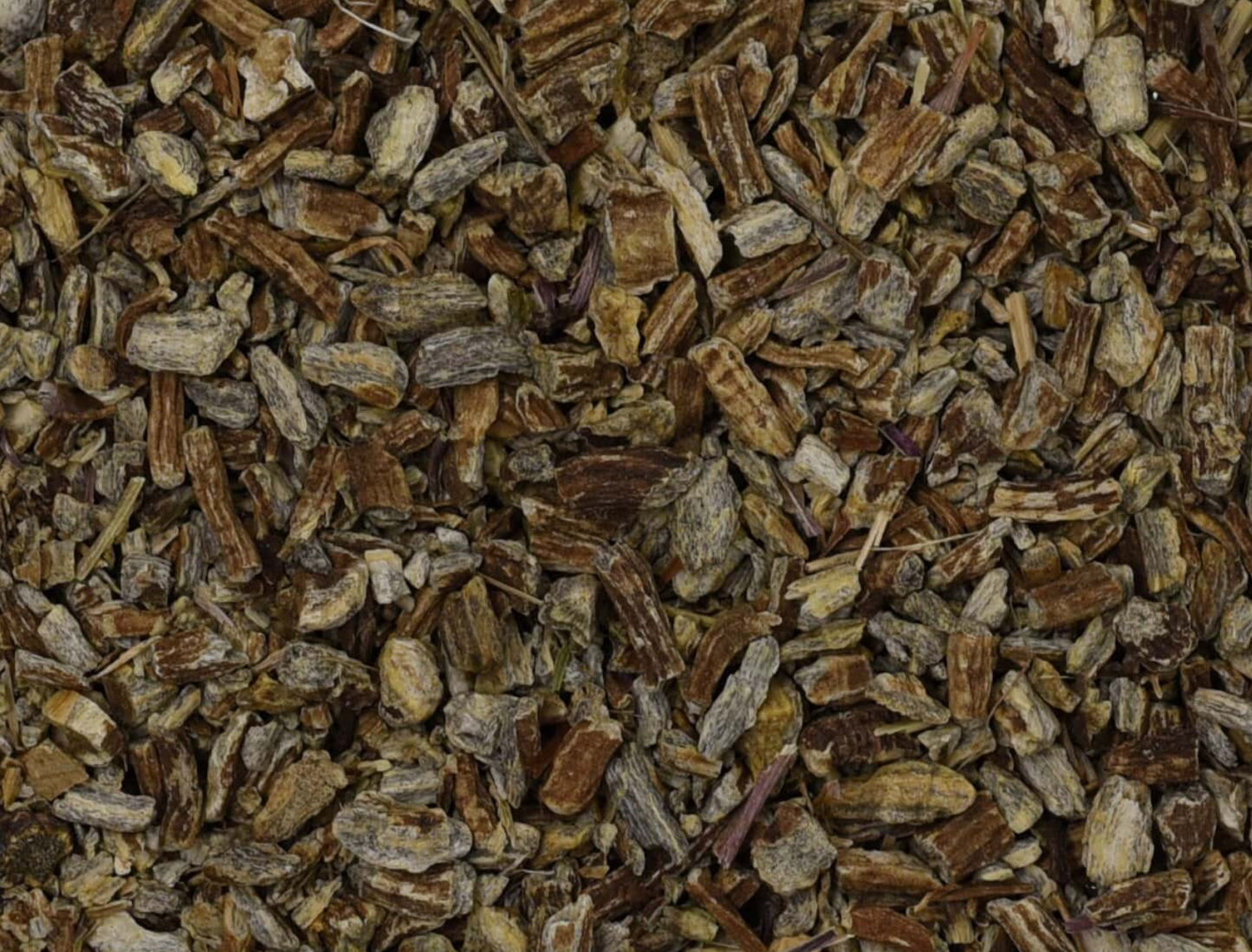 Close-up of dried echinacea root, showing small brown root pieces used for teas and herbal remedies.
