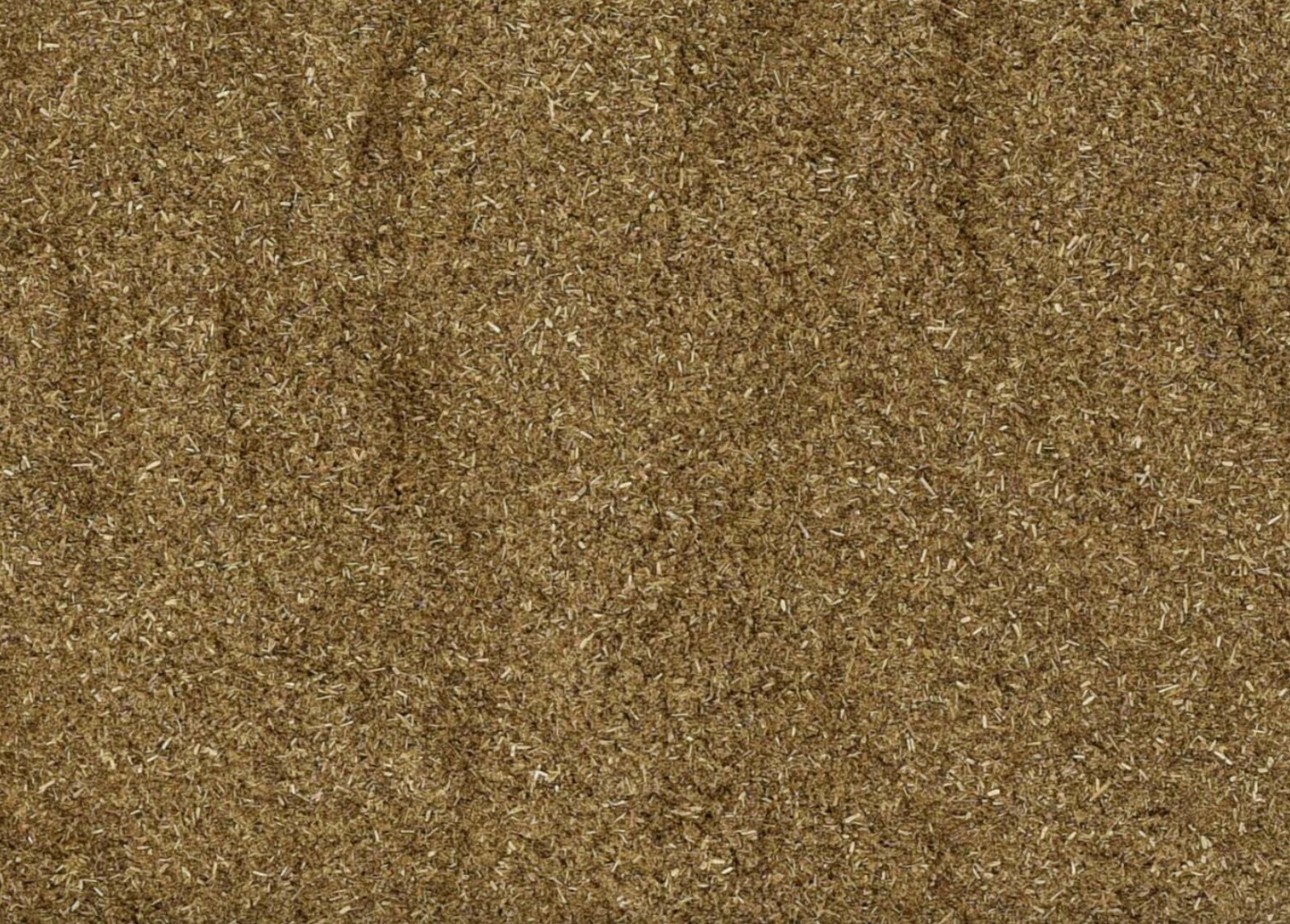 Close-up of dried eyebright powder, showing finely ground brown powder used for teas and herbal remedies.