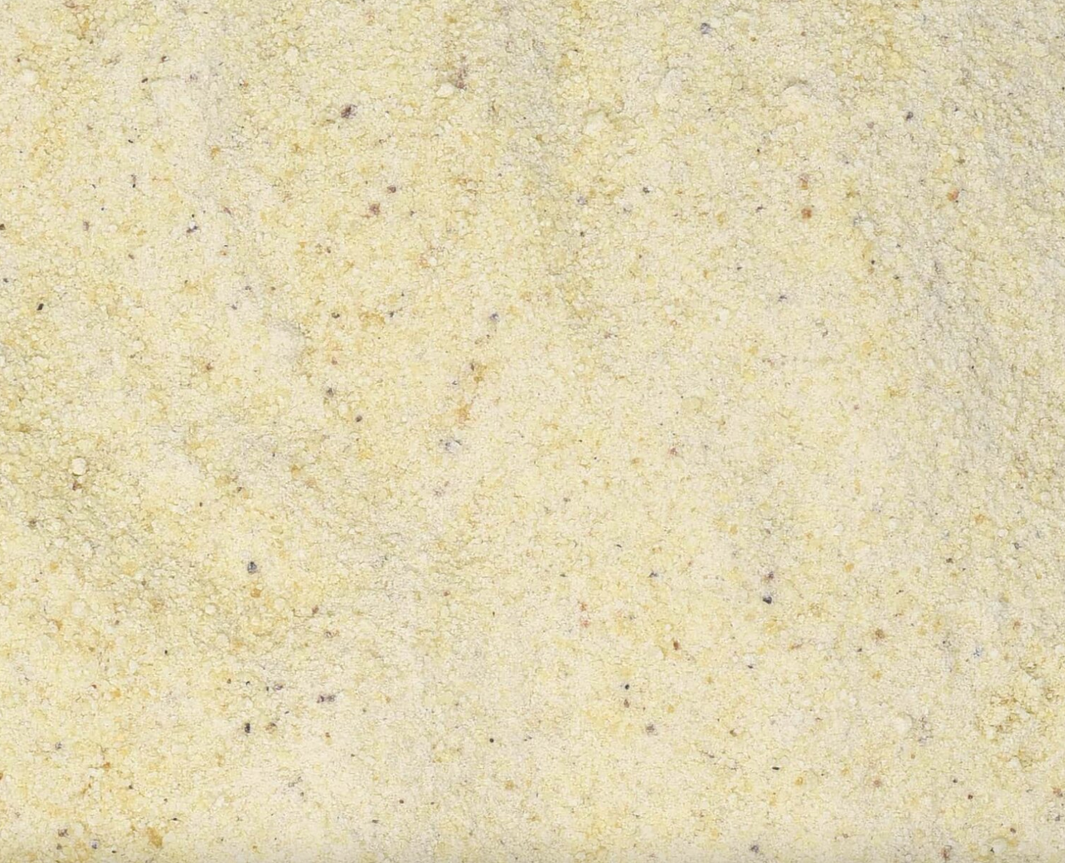 Close-up of dried frankincense powder, showing finely ground beige powder used for teas and herbal remedies.