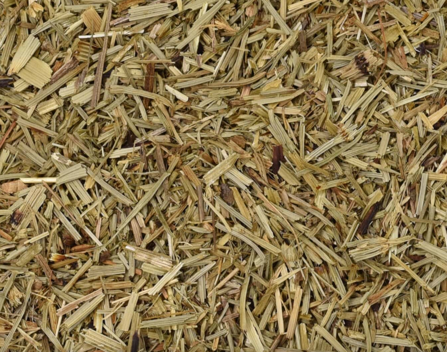 Close-up texture of dried horsetail herb, showing small green herb pieces used for teas and herbal remedies.