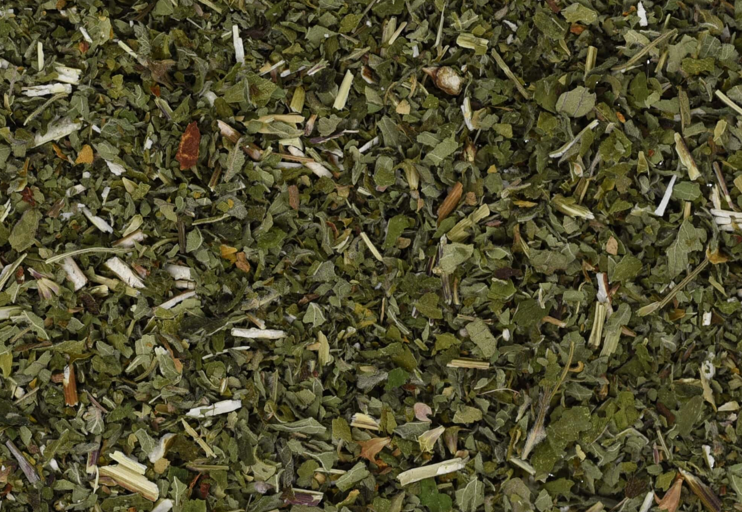 Close-up of dried motherwort herb, showing chopped stems, leaves, and pieces used for teas and herbal remedies.