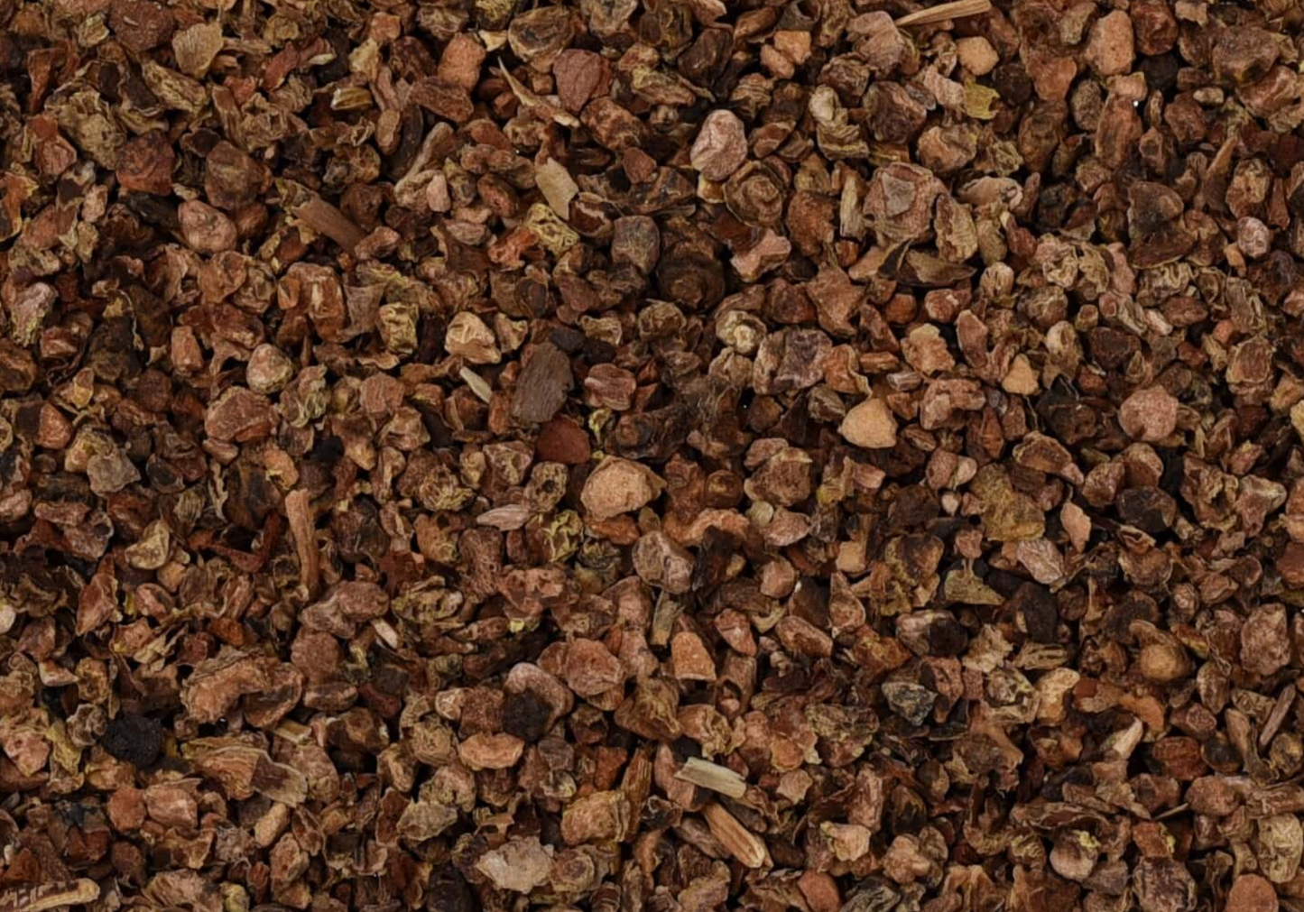 Close-up of dried rhodiola root, showing chopped root pieces used for teas and herbal remedies.