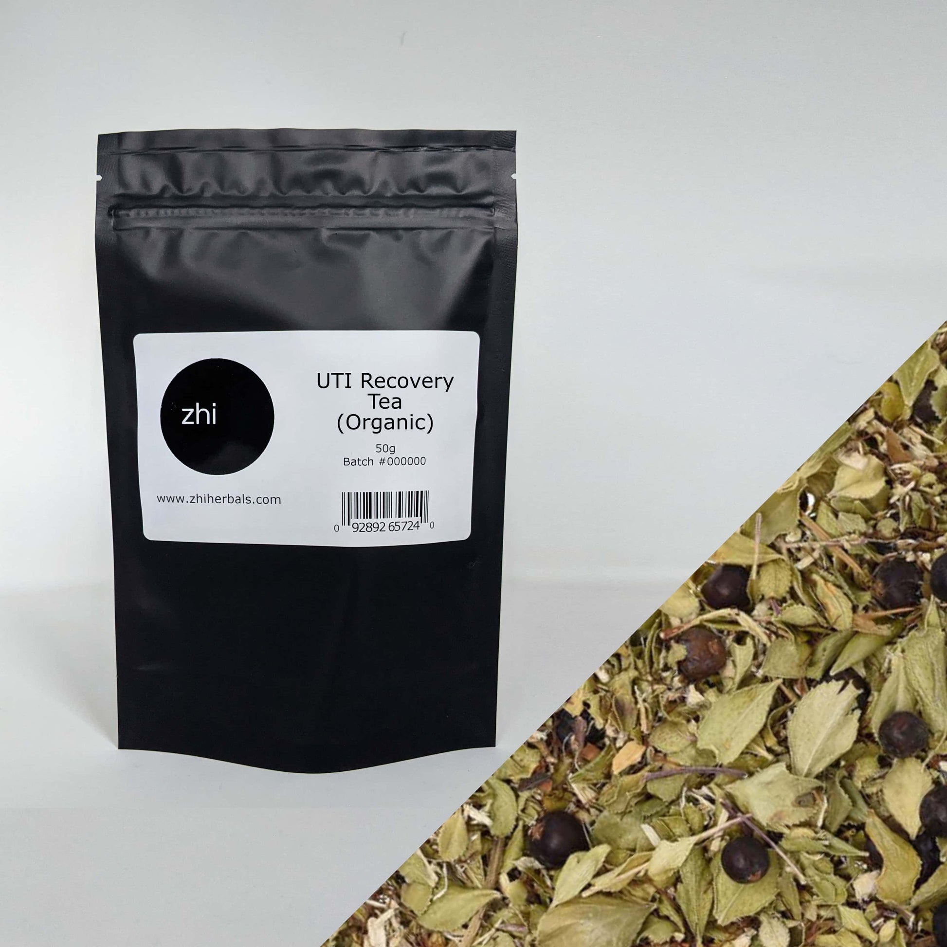 Zhi Herbals Organic UTI Recovery Tea, 50g black package with label, next to a close-up of the green tea blend.