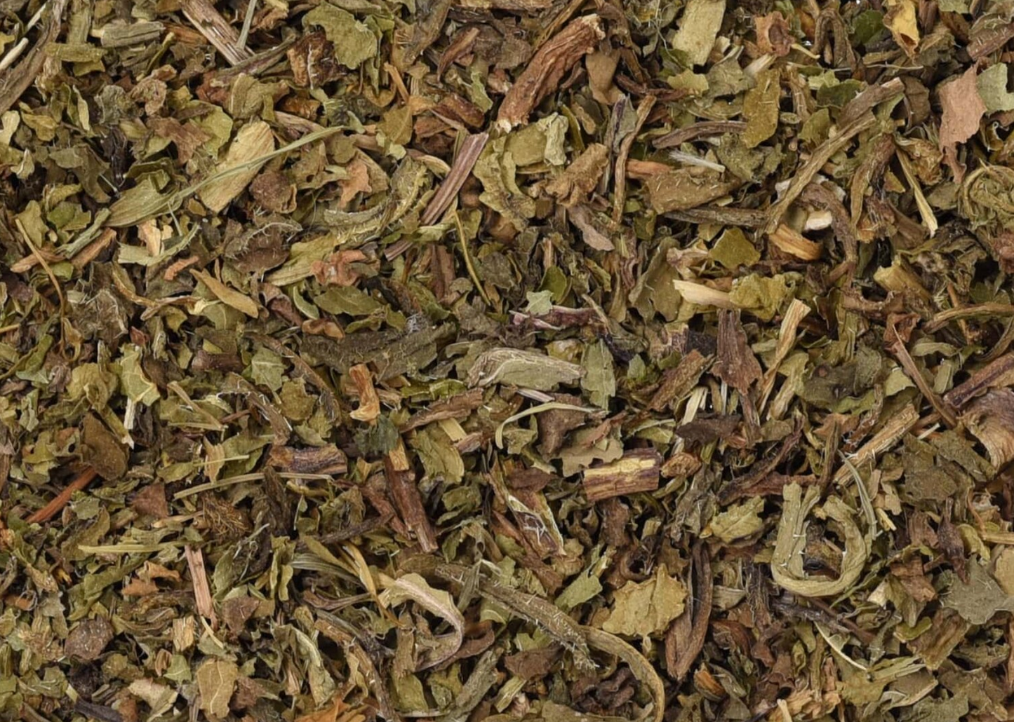 Close-up of dried wild lettuce herb, showing chopped leaves and pieces used for teas and herbal remedies.