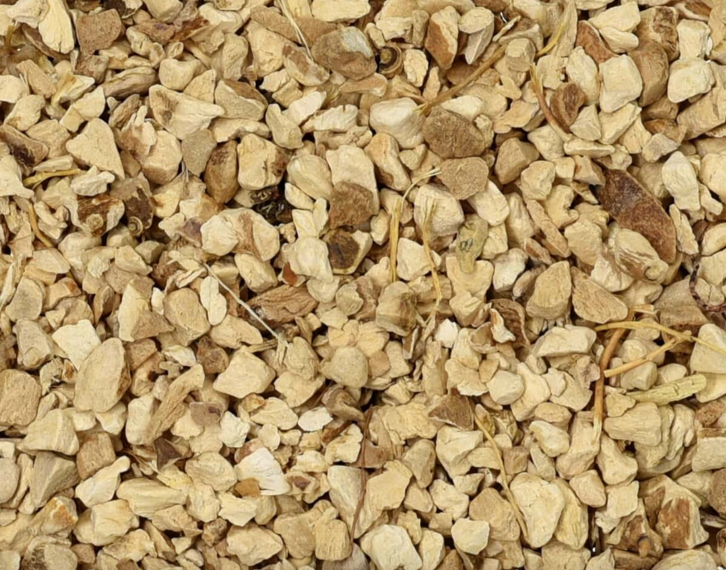 Close-up of dried wild yam root, showing beige chopped root pieces used for teas and herbal remedies.