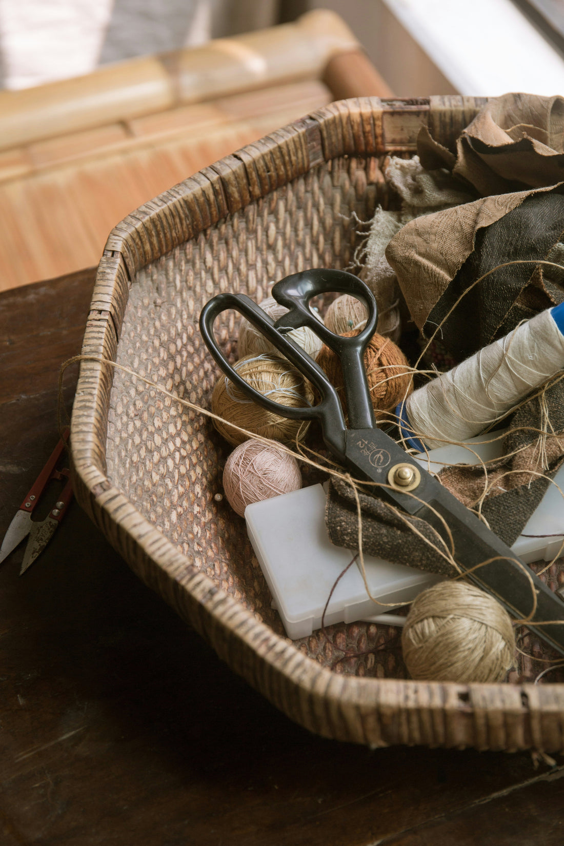 Sewing supplies in a basket.