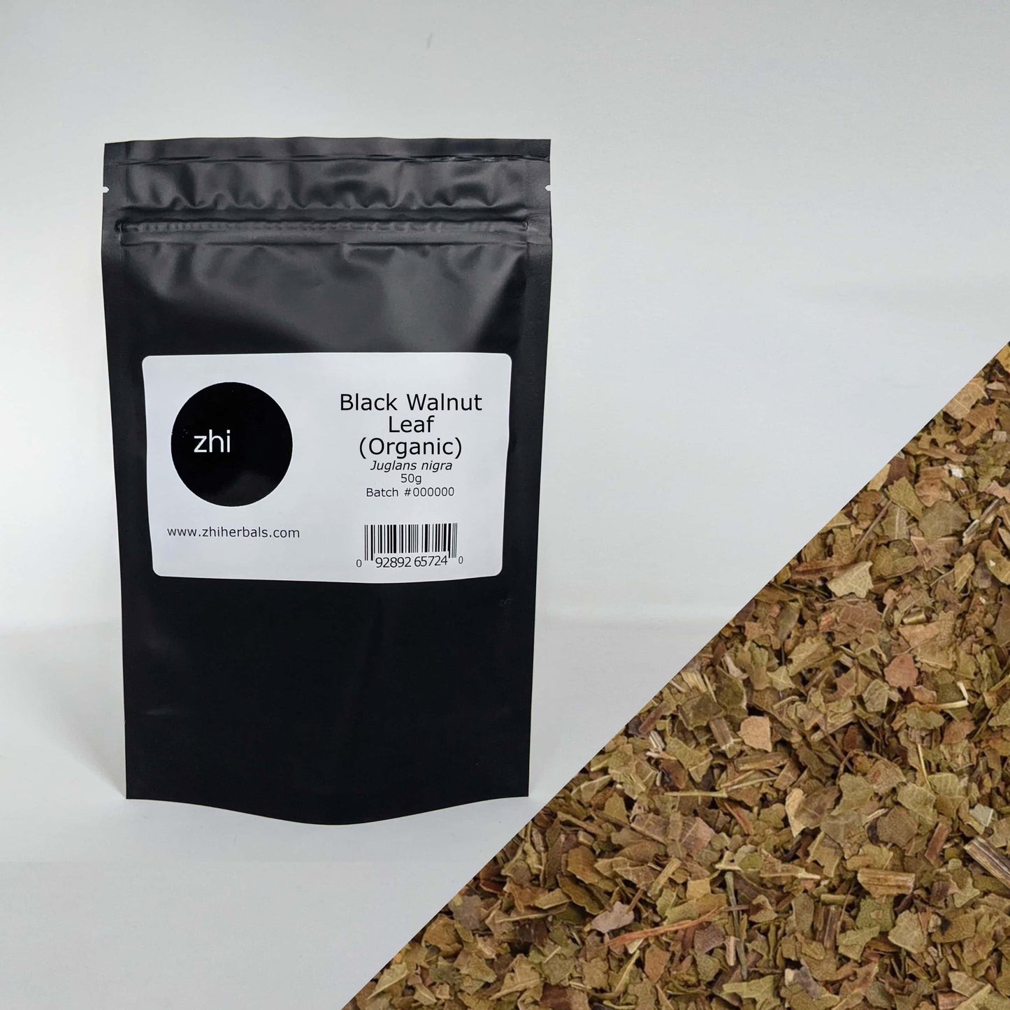 Zhi Herbals Organic Black Walnut Leaf, 50g black package with label, next to a close-up of the green leaf pieces.
