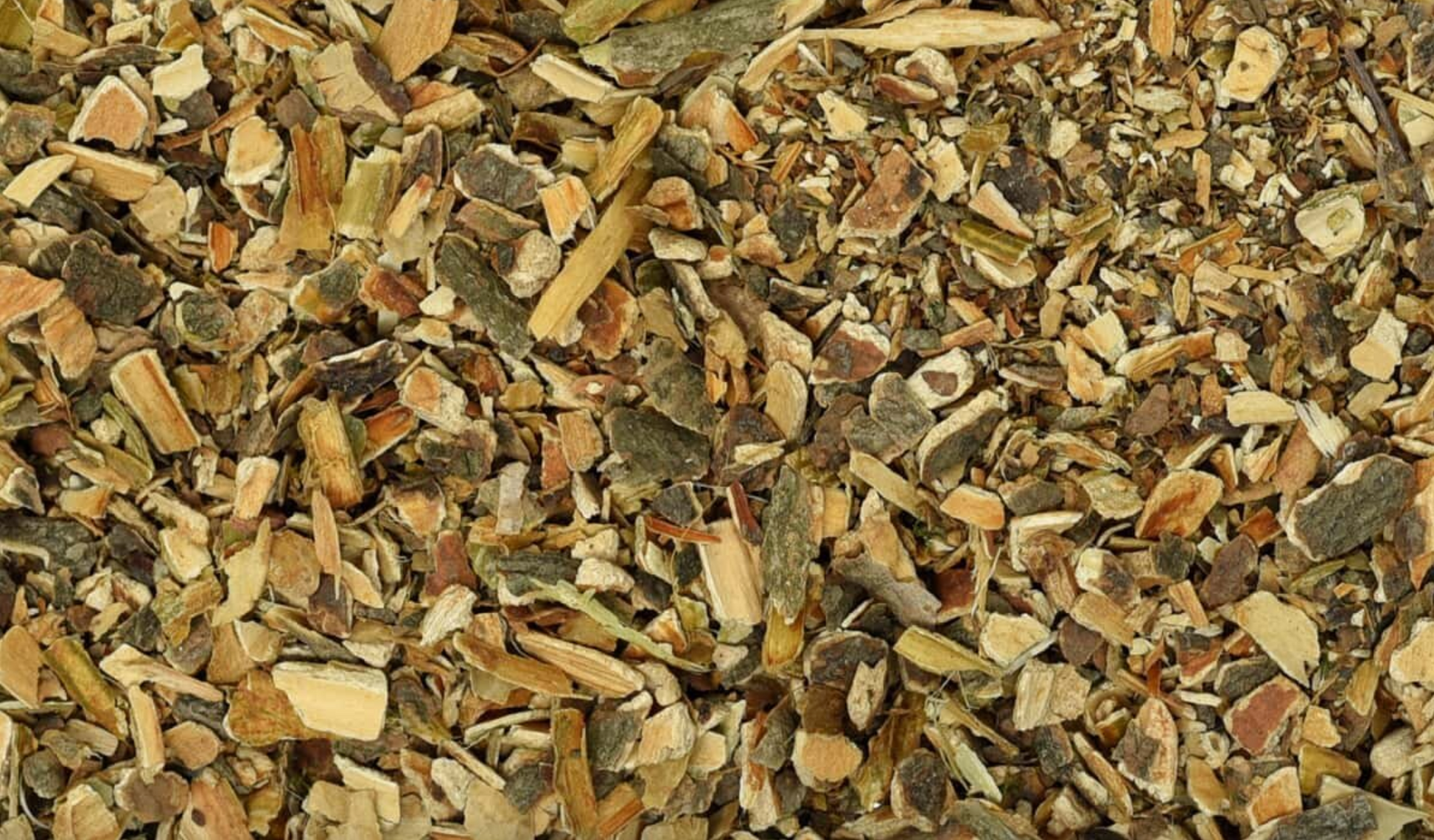 Close-up texture of dried cramp bark pieces, showing brown cut bark used for teas and herbal remedies.